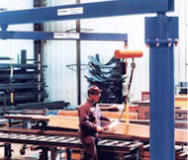 Jib crane set up in a warehouse for easy transportation of heavy materials.